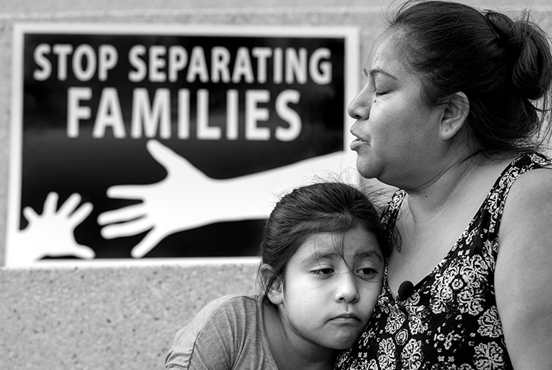 A child and her mother participate in a protest against migrant detention centres. Organisers called on the Trump administration to close the migrant detention centres and to stop the family separation policies.