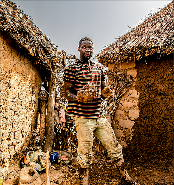 Repairing A Mud Wall, Ghana, by David Portwain