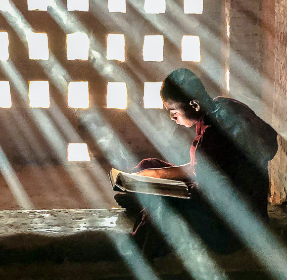 Monk Contemplating A Book, Myanmar