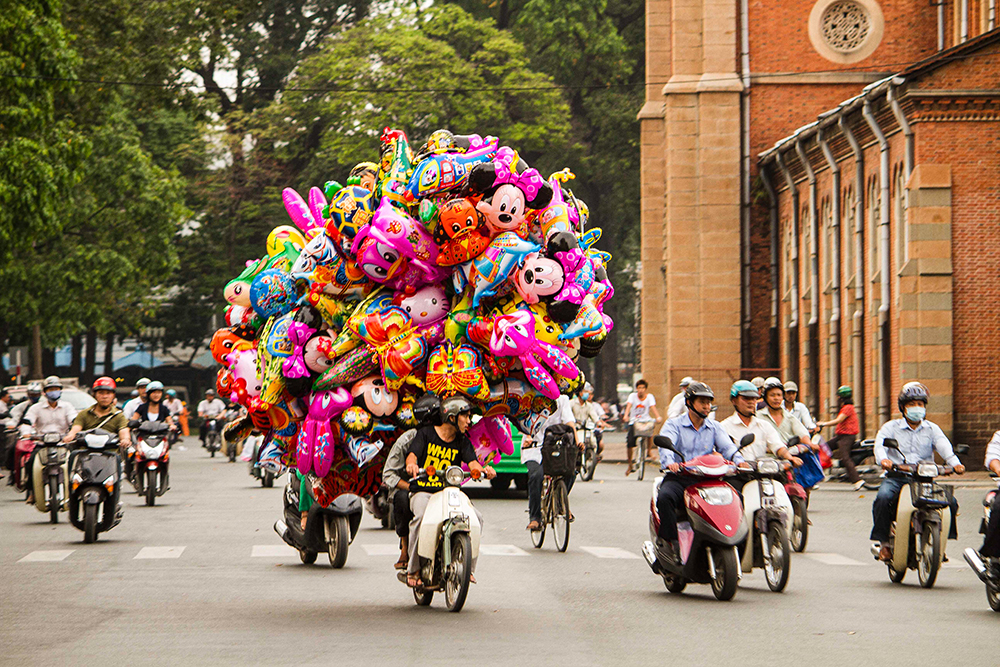 Crossing The Road In Saigon At Christmas, by David Portwain