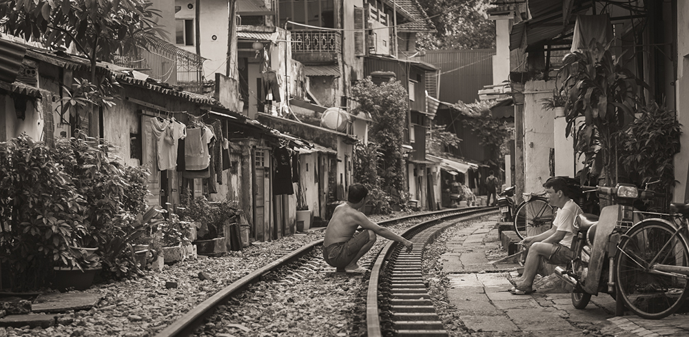 A Neighbourly Chat, Rail Street, Hanoi by Stu Thompson