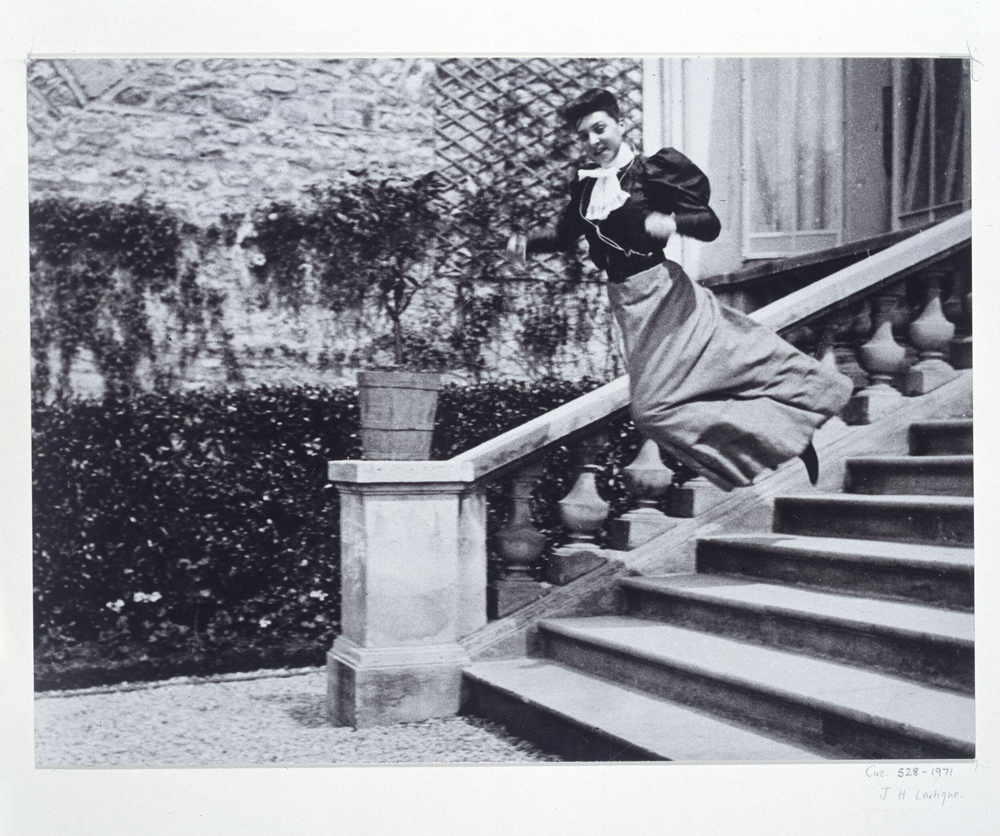 Photograph of a woman jumping down some steps