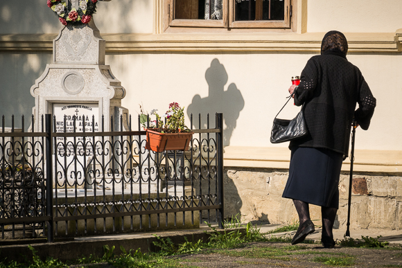 Rural Romania Widow With Offering In Churchyard