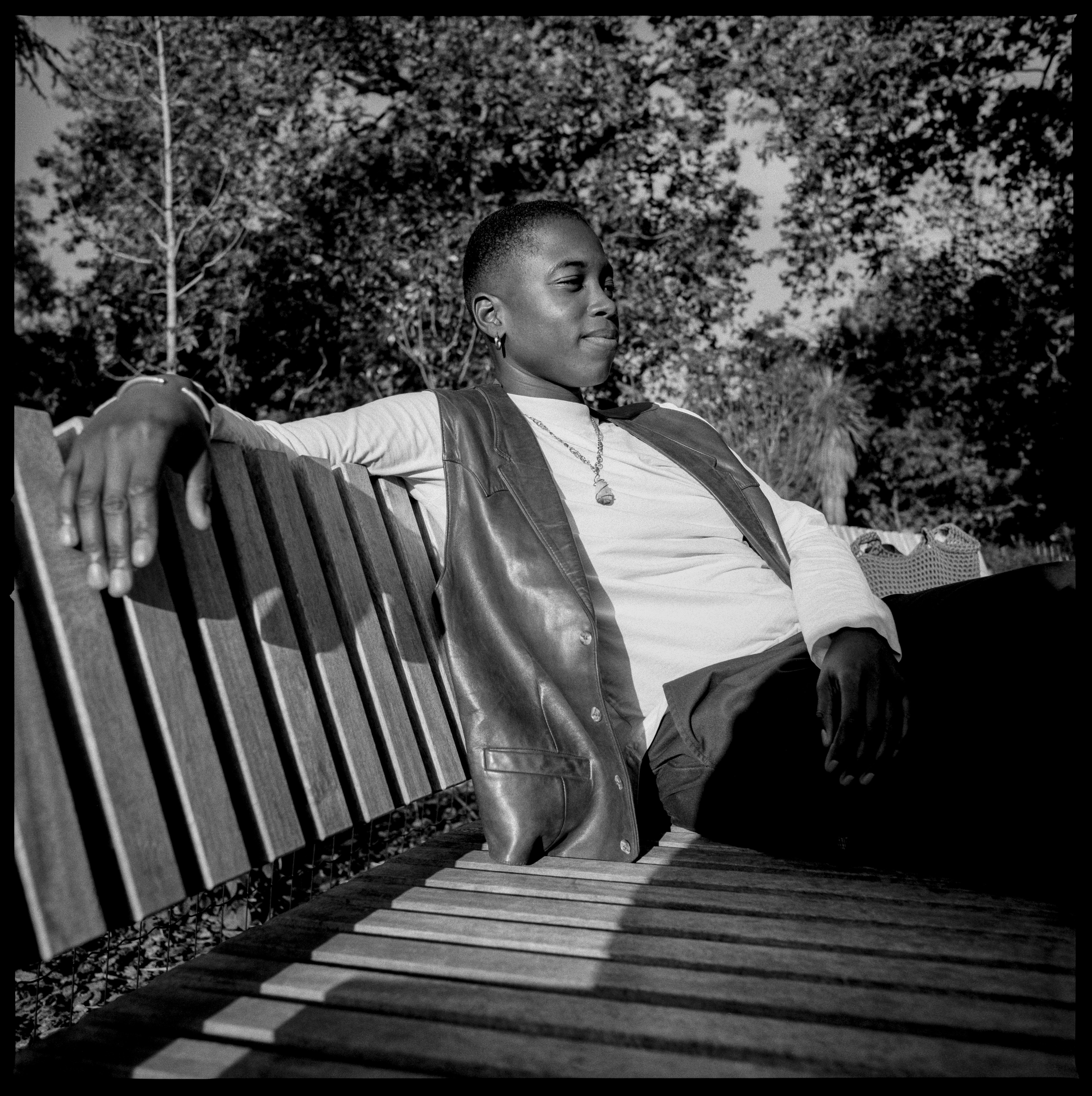 Myah Asha Jeffers sitting on a bench in a black and white photo