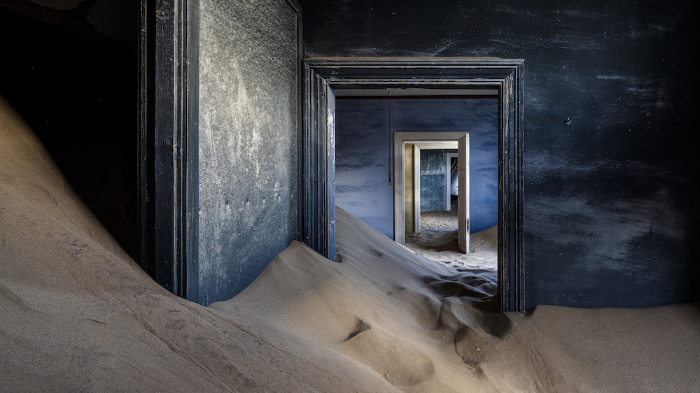 Desert reclaiming Kolmanskop, Namibia by Omar Shamma